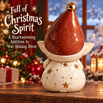 Rear view of the Christmas elf figurine showing the red pointed hat and gold-tone stars on its speckled cream outfit.