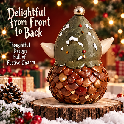 Rear view of the pinecone elf figurine showing overlapping brown details and white snow-like accents on its green hat.