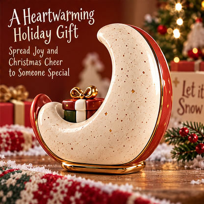 Reverse-angle holiday display of the crescent moon decoration with its red outer edge, gold-tone base and gift-box motif.